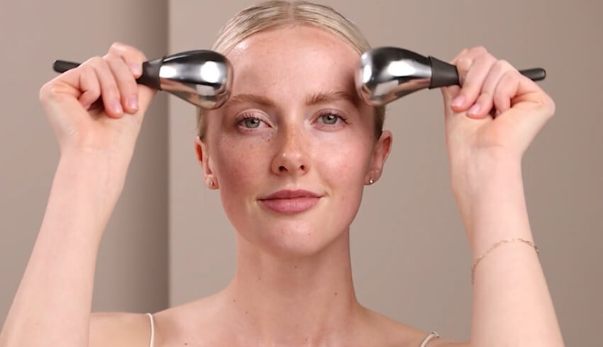 blog-article Woman holding Cryo-Thermal Tools to face